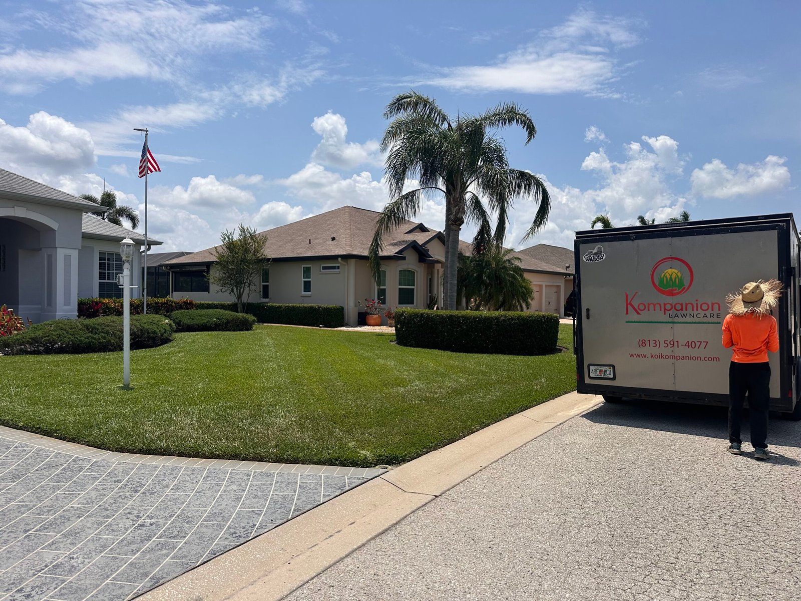 Kompanion crew mowing a Florida lawn