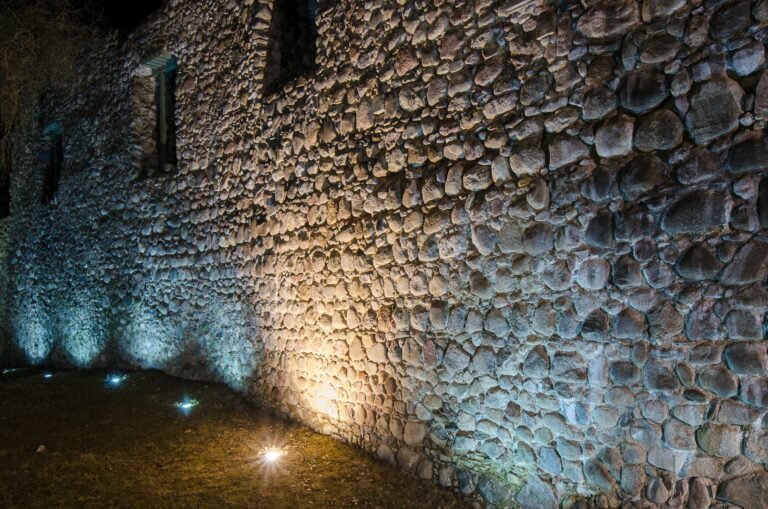 Candlelight row at an ancient fortress wall